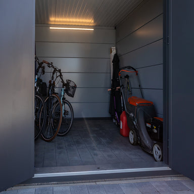 Telluria Sustainable Eleganto Plus Steel Shed in Anthracite. Inside view through open front door.