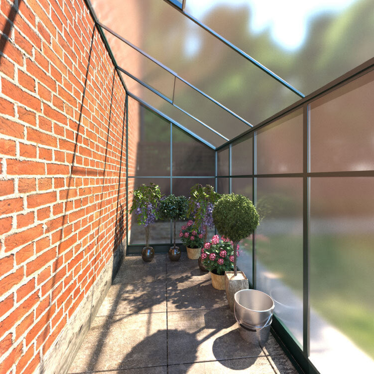 Small Space Metal and Polycarbonate Lean-To Greenhouse. Inside view from entrance looking down the greenhouse, situated in a garden attached to a house.