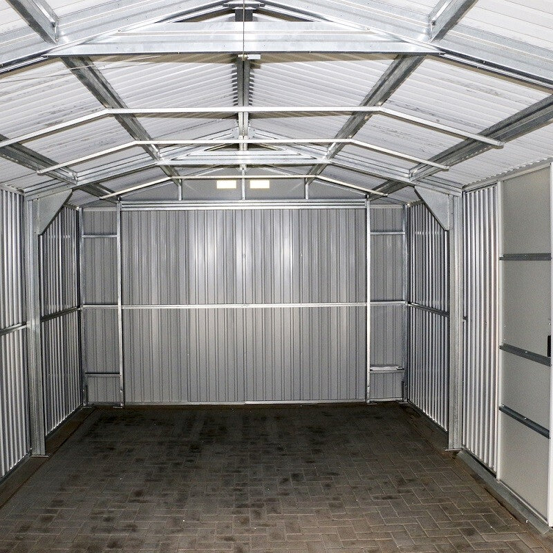 Sapphire Apex Metal Garage, Olympian Fronted in Anthracite Grey. Inside view down the building towards the back end. Shows internal structure and side door on the right.