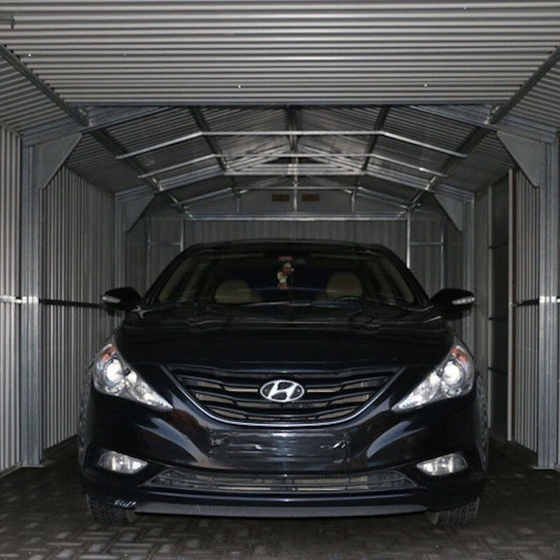 Sapphire Apex Metal Garage, Olympian Fronted in Anthracite Grey. Inside view showing a medium sized car in storage.